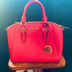 Michael Kors: red leather handbag.